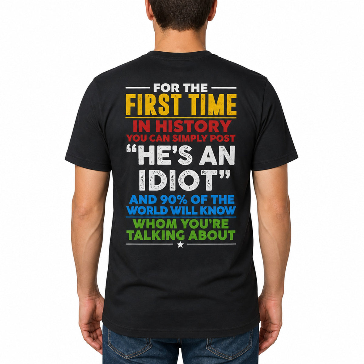 Plain t-shirt with bold typographic text reading "He's an idiot" centered on the chest