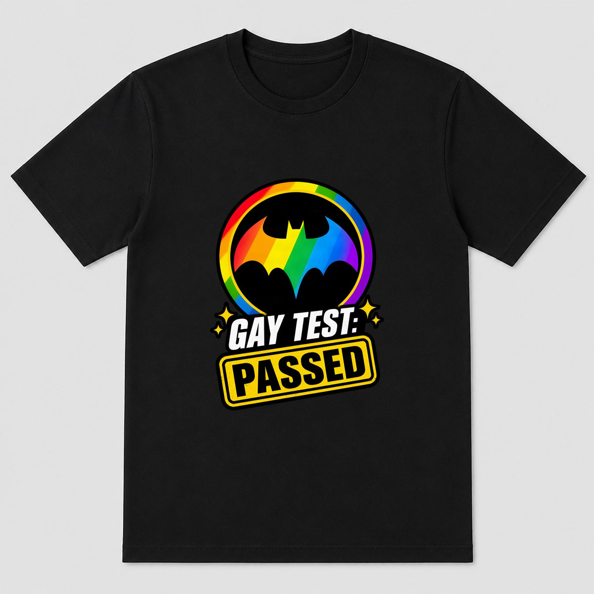 Retro bat-logo parody with bold text GAY TEST: POSITIVE on a novelty pride t-shirt.