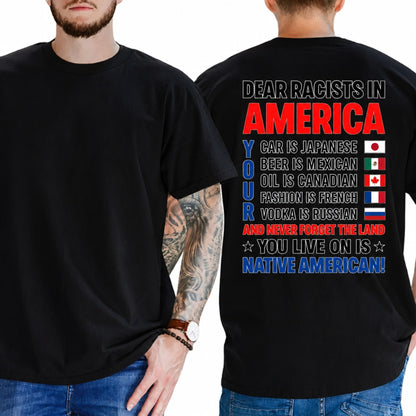 T-shirt reading 'RACISM IS NOT PATRIOTISM' with stylized flag graphics in bold typography