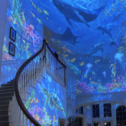 Child watching colorful sea creatures on ceiling