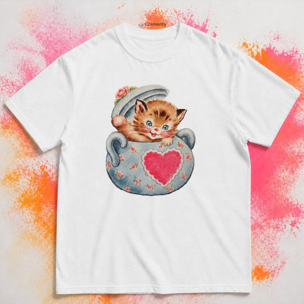 Mischievous kitten popping from decorative teacup with heart, hand-drawn edgy line art on a t-shirt
