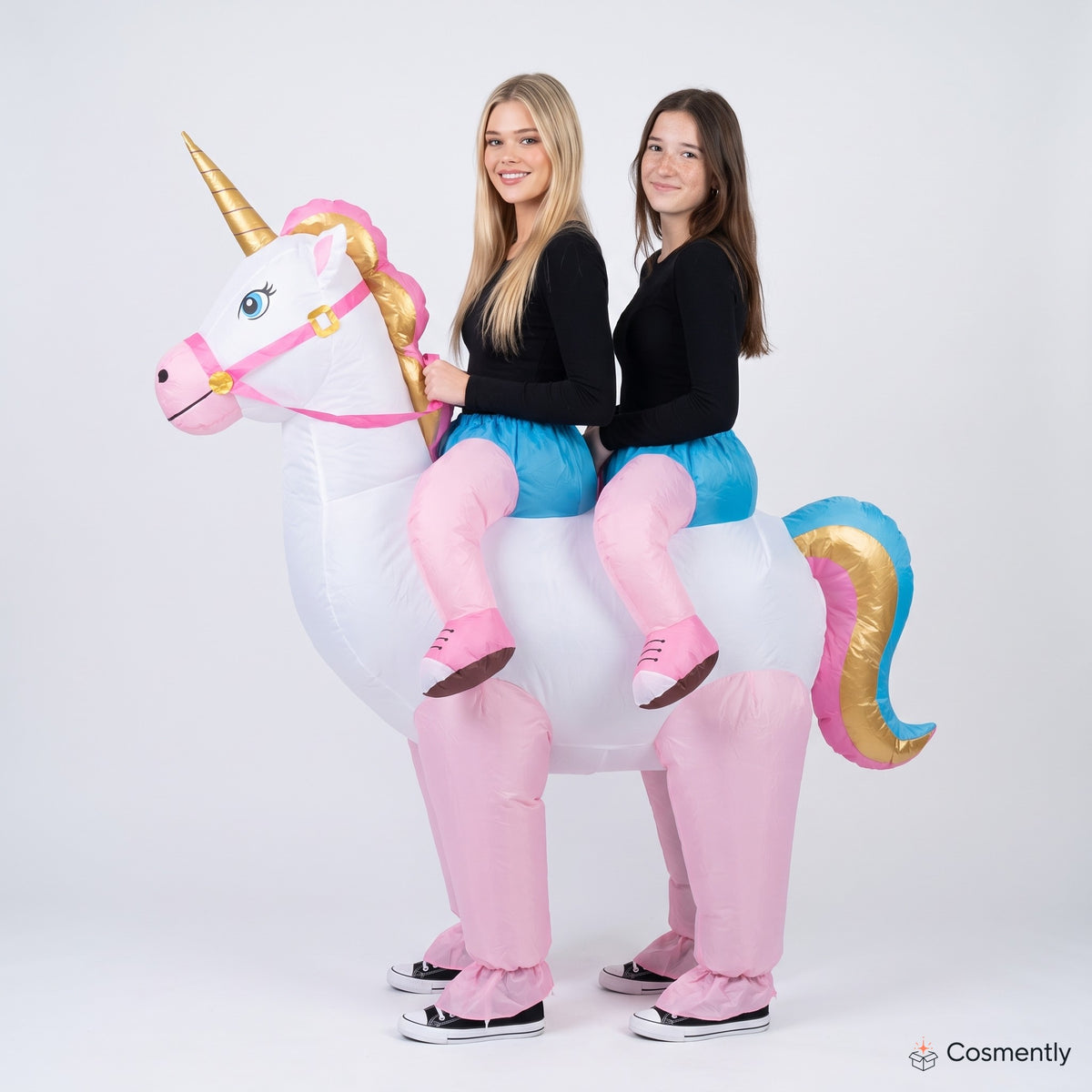 Two people wearing inflatable unicorn costume at party